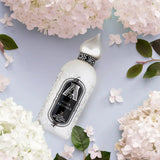 Attar Collection Musk Kashmir Eau de Parfum 100ml bottle with elegant silver cap, surrounded by white hydrangeas on a pastel background. A luxurious unisex fragrance in the Health & Beauty > Personal Care > Cosmetics > Perfumes & Colognes > Eaux de Parfum category.