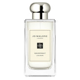 Jo Malone Grapefruit Cologne 100ml bottle with sleek transparent glass and silver cap, showcasing a minimalist luxury perfume design.