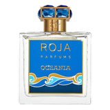 Roja Parfums Oceania – Extrait de Parfum (100ml) in a clear glass bottle with blue and gold ocean-themed label and jewel-like cap.